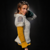 Back of the Artisan Harmony sweater on an autumn city street, showing its asymmetric colour placement.