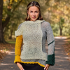 Textural contrast between chunky cream knitting and the airy sleeve of Artisan Harmony.