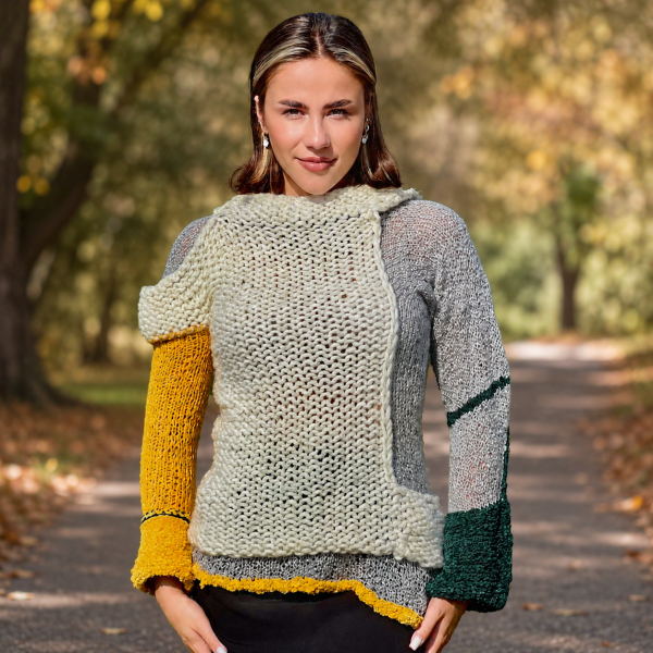Textural contrast between chunky cream knitting and the airy sleeve of Artisan Harmony.