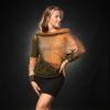 Amber Caprice by the riverside, styled with a black skirt in warm evening light.
