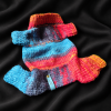 All Four sweater All Four mājdzīvnieku džemperis izklāts uz melna auduma