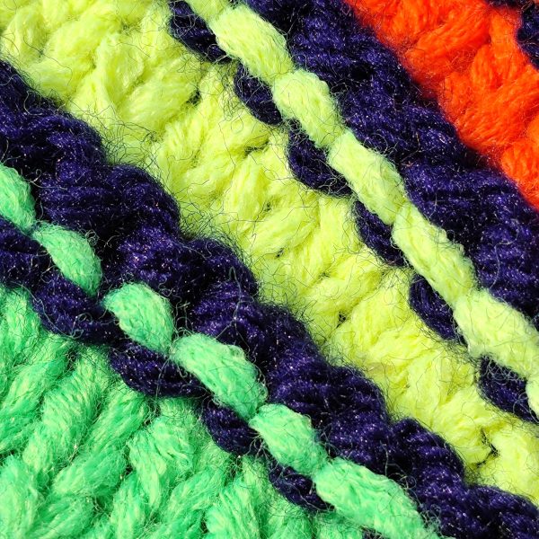 Almost Invisible Details Close-up of neon green, orange and purple knitted stripes