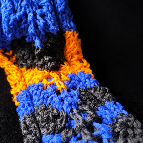 Already Taken details (2) Close-up of blue, black and orange knitted textures