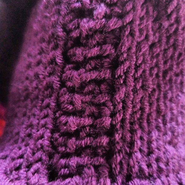 Graceful Exit details (1) Close-up of the deep purple handmade knit texture